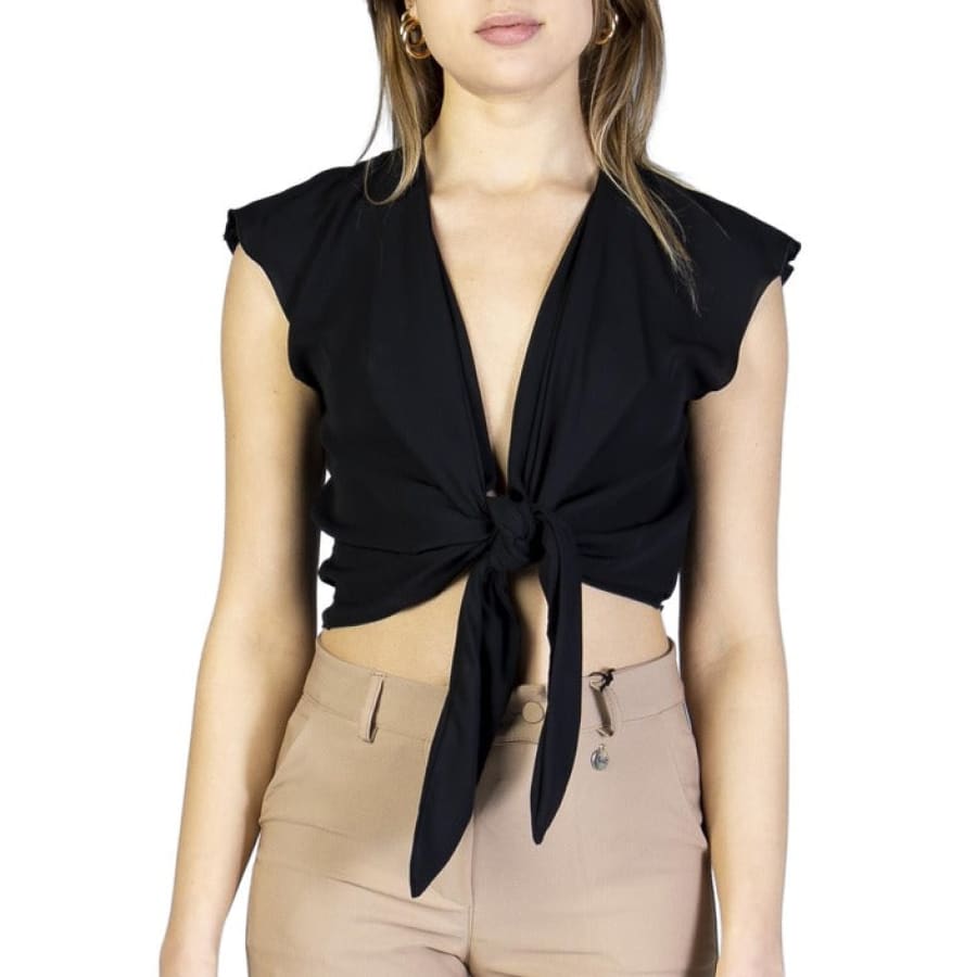 Elegant woman in unique Italian black tie-neck top from Akè collection