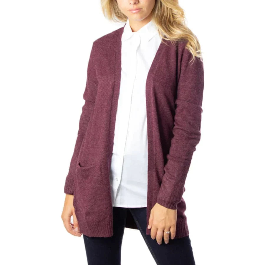 Woman in cozy stylish burgundy cardigan sweater.