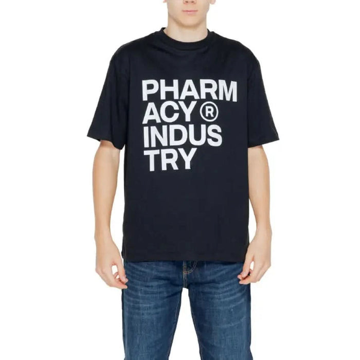 Young boy in black urban style Pharmacy Men T-Shirt reading ’pharm acy indusus try’