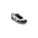 Athletic sneaker in white and black color scheme with logo from Le Coq Sportif