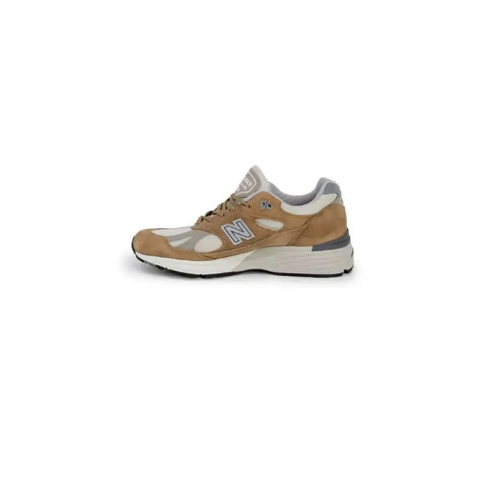 New Balance Men Sneakers in tan and gray colors featuring a chunky sole design