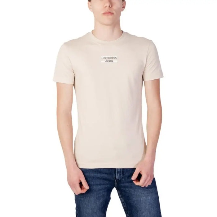 Beige Calvin Klein Jeans T-Shirt paired with blue jeans in Calvin Klein Jeans Men T-Shirt display