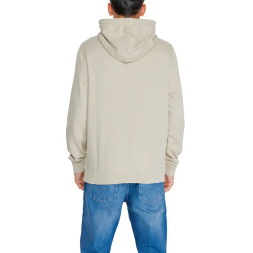 Back view of beige hooded sweatshirt and blue jeans from Calvin Klein Jeans Men Sweatshirts