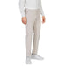 Beige Antony Morato men trousers styled with white sneakers and a white top