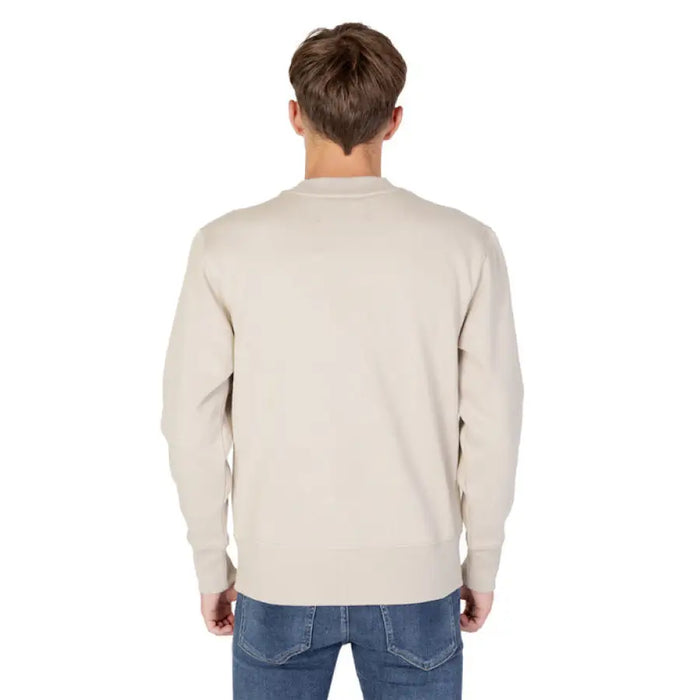 Beige long-sleeved sweater worn by a person, Calvin Klein Jeans Men Sweatshirts