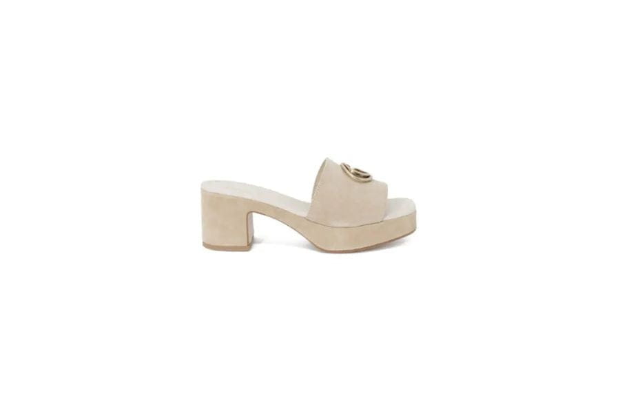 Beige platform sandal with chunky heel and metal hardware for stylish summer outfits.