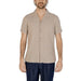 Hamaki-ho Men Shirt: Beige short-sleeved button-up worn by man with dark pants