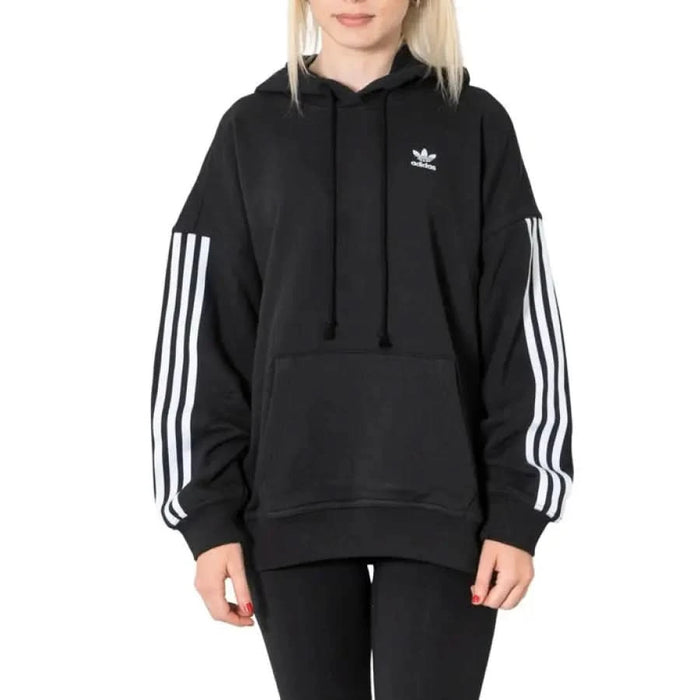 Black Adidas hoodie with white stripes on sleeves for women in Adidas sweatshirts