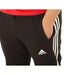 Black Adidas track pants with white side stripes from Adidas Men Trousers collection