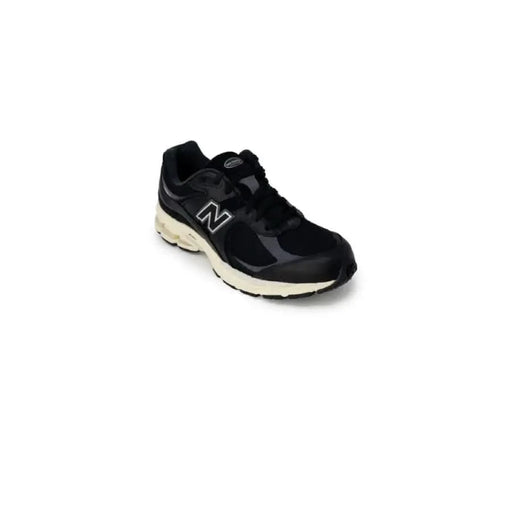 Black New Balance athletic running shoe with white sole from New Balance Men Sneakers