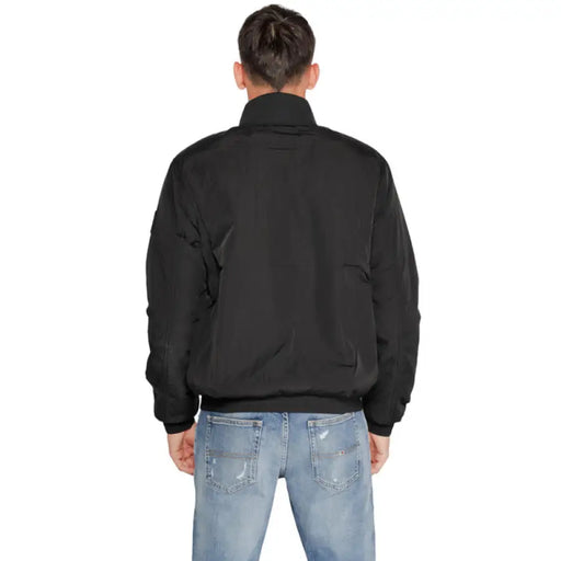 Black bomber jacket from the back view in Calvin Klein Men Jacket collection