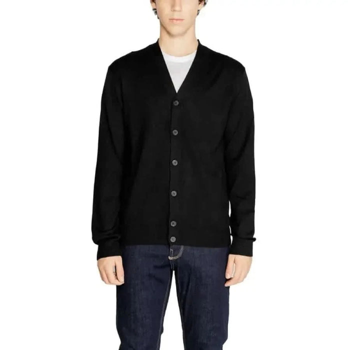 Black Hamaki-ho cardigan sweater over a white t-shirt, perfect for versatile styling