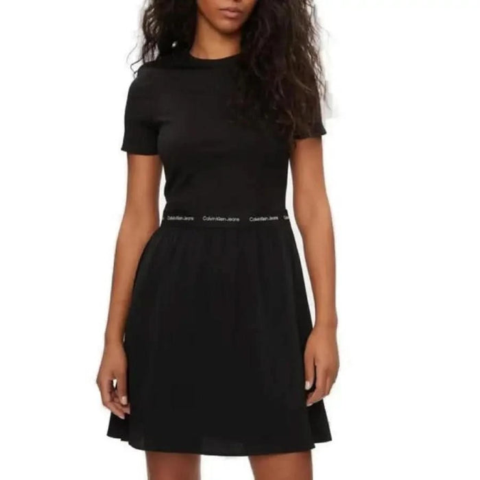 Black Calvin Klein short-sleeved dress with fitted top and flared skirt for women