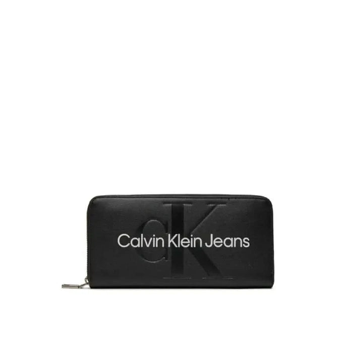 Black Calvin Klein Jeans wallet with zipper closure, sleek design for women