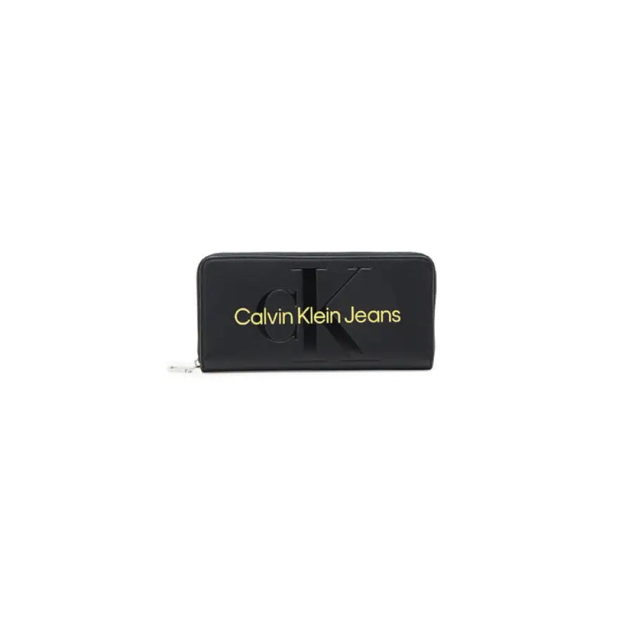 Black Calvin Klein Jeans women’s wallet with gold lettering and zipper closure