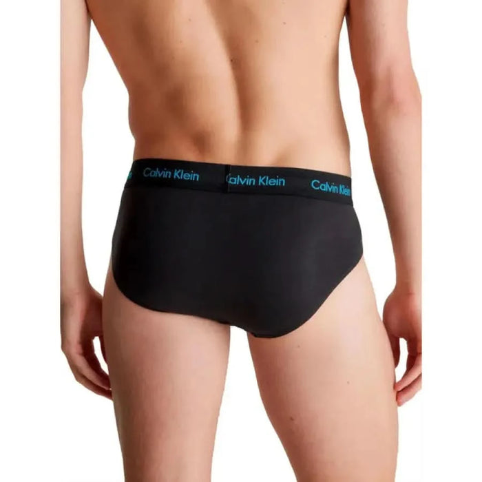 Model wearing Black Calvin Klein men’s briefs, product: Calvin Klein Men Underwear