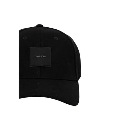 Black Calvin Klein baseball cap featuring a square logo patch for men