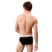 Black Calvin Klein briefs featuring a white elastic waistband for men’s underwear