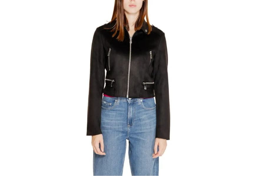 Black cropped jacket featuring zipper front and silver hardware for chic summer work outfits.