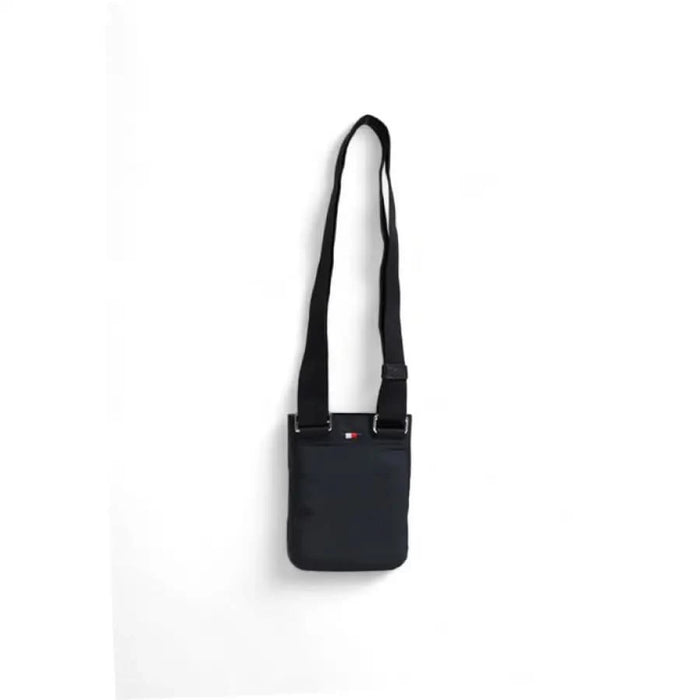 Black crossbody bag with long strap and rectangular pouch by Tommy Hilfiger