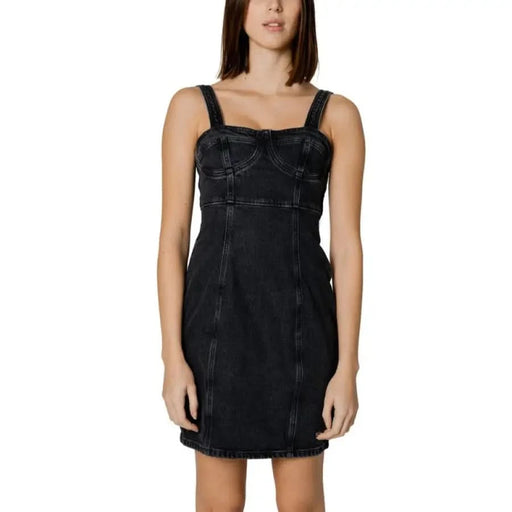 Black denim mini dress with structured bodice and thin straps by Tommy Hilfiger