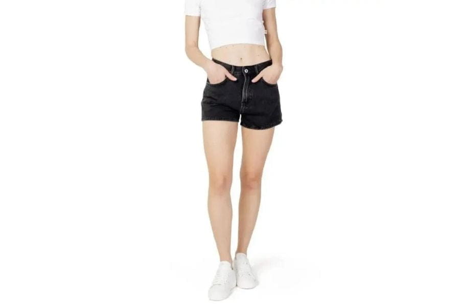 Black high-waist denim shorts with rolled cuffs, perfect for a first date outfit.