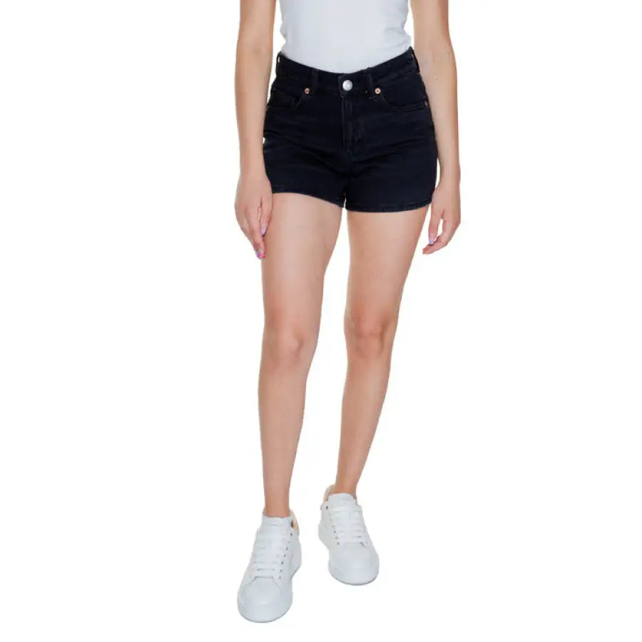 Vero Moda black denim shorts paired with a white top and sneakers for a stylish look