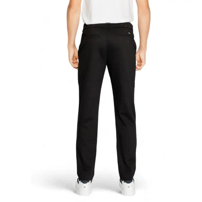 Calvin Klein Men Trousers black dress pants paired with white sneakers stylish composition