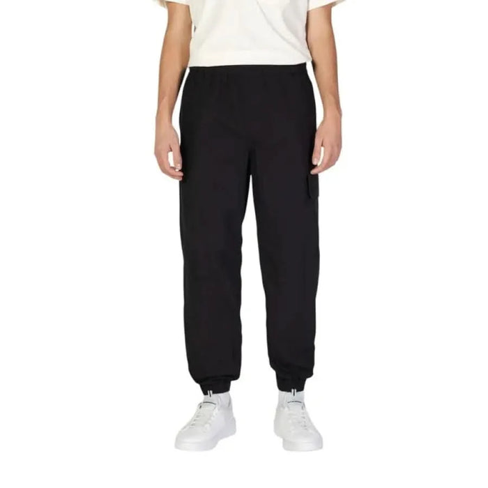 Black elastic-cuffed sweatpants with relaxed fit from Calvin Klein Jeans Men Trousers