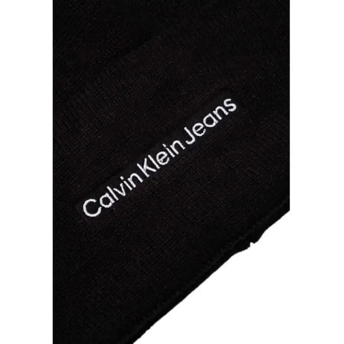 Black fabric cap featuring white Calvin Klein Jeans logo text for men