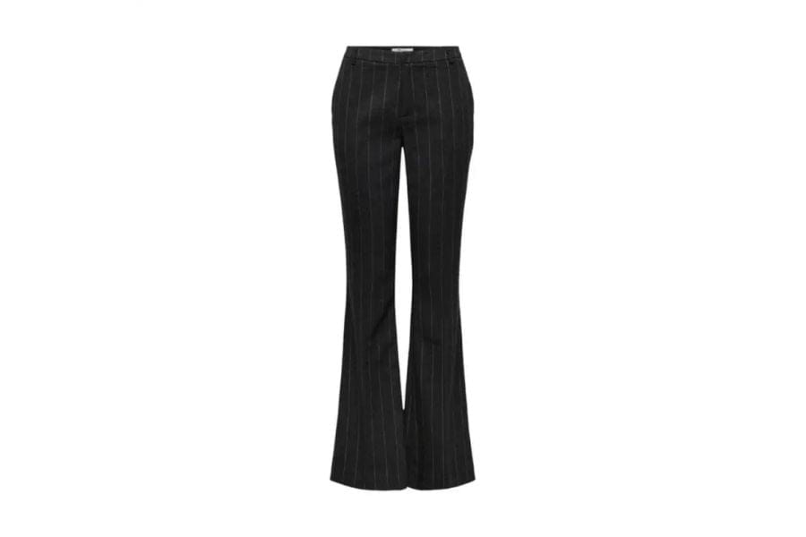 Black flared trousers showcasing retro fashion style in a timeless outfit article.