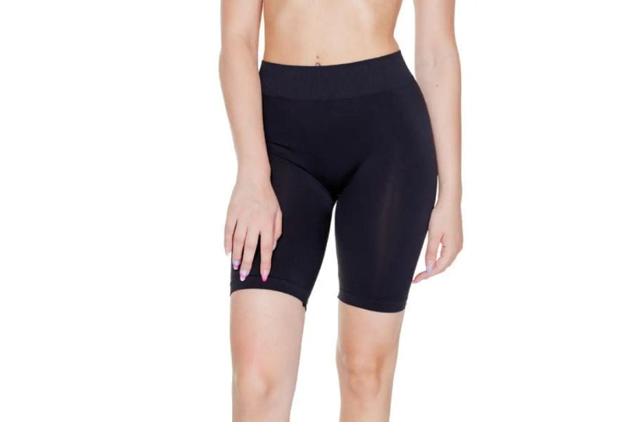 Black form-fitting cycling shorts complement summer outfit ideas for a stylish look.