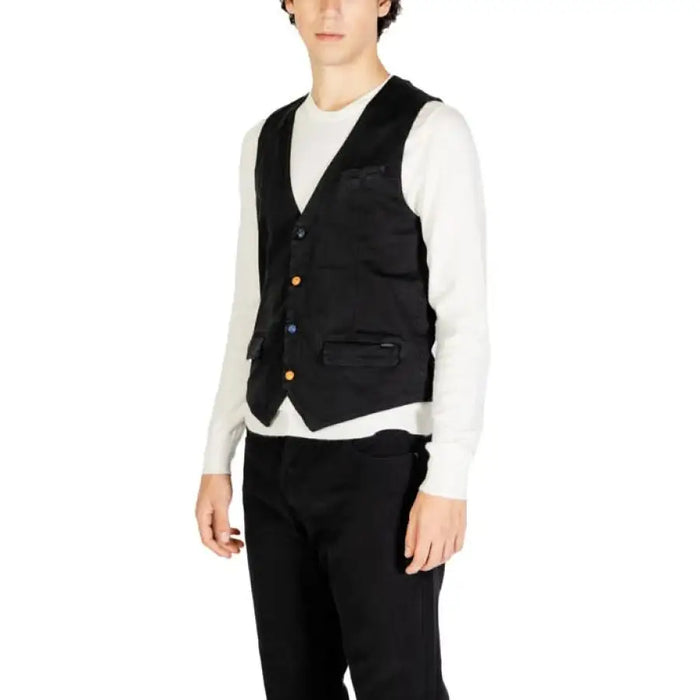 Black formal vest with gold buttons worn over a white long-sleeve shirt by Gianni Lupo