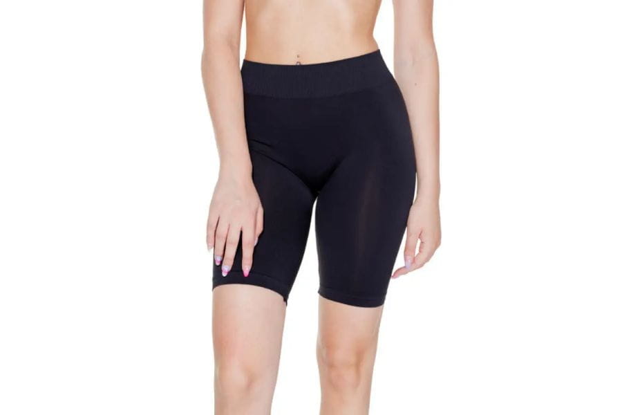 Black high-waisted cycling shorts as essential holiday apparel for a stylish outfit.