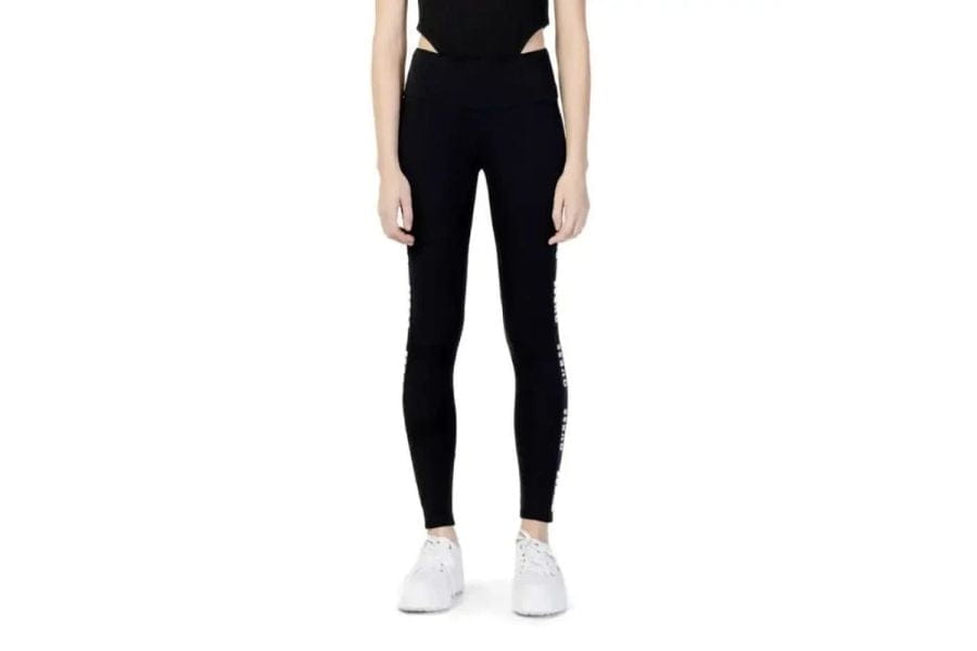 Black high-waisted leggings with stylish side cutouts for a first date outfit.