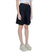 Black knee-length shorts worn with a white top and chunky white platform shoes - Only Women Short