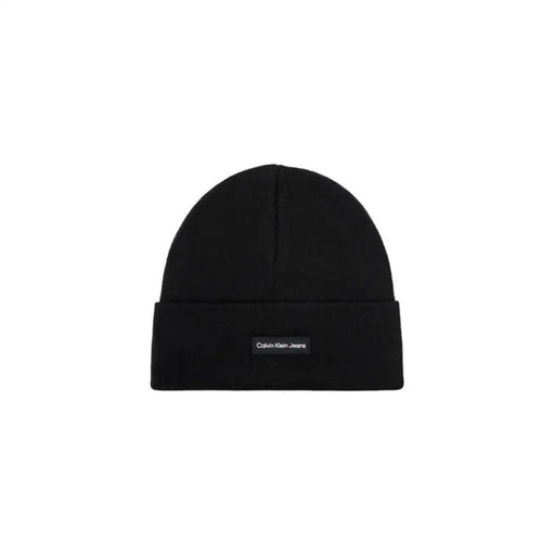 Black knit beanie featuring a small branded label from Calvin Klein Men Cap collection