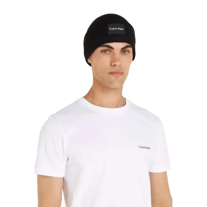 Black knit beanie hat featuring Calvin branding from Calvin Klein Men Cap