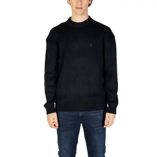 Black knit crewneck sweater paired with dark jeans from Calvin Klein Jeans Men Knitwear