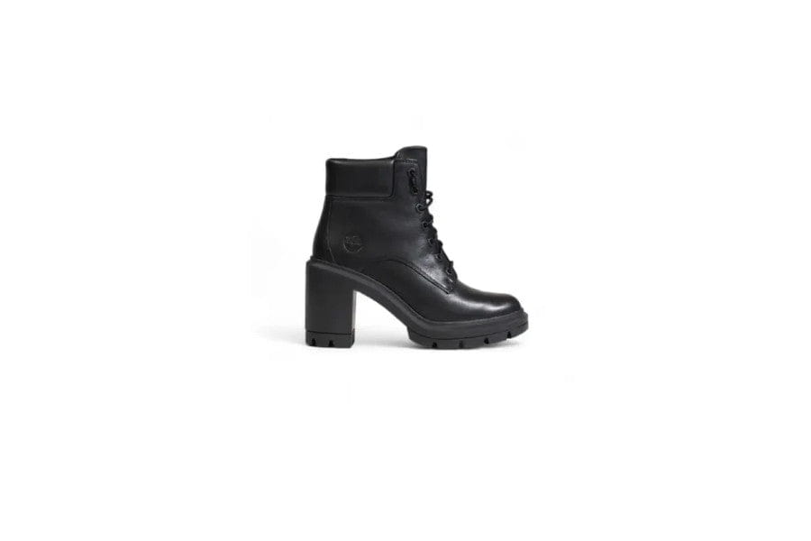 Black leather ankle boot with chunky heel and lug sole enhancing the Old Money style elegance look