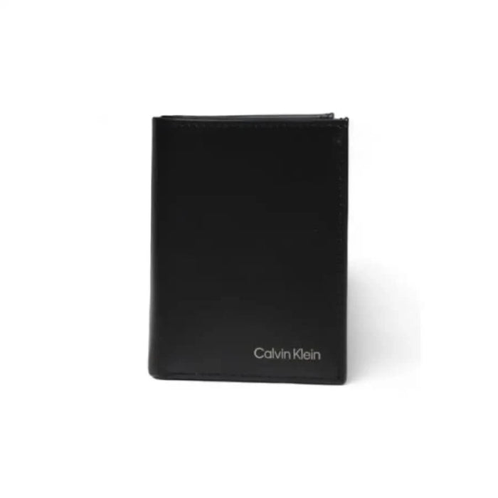 Black leather Calvin Klein wallet featuring silver branding, sleek men’s accessory