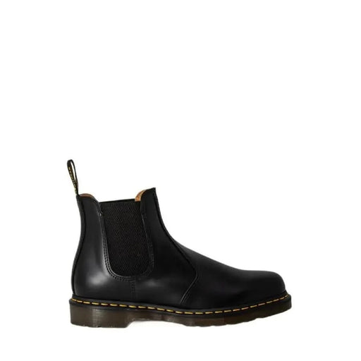 Black leather Chelsea boot with elastic side panels and chunky sole by Dr. Martens