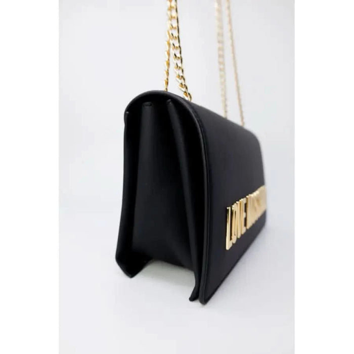 Black leather handbag with gold chain strap and metallic lettering by Love Moschino