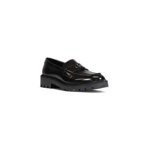 Calvin Klein Women Moccasin: Black leather loafer with chunky sole and metal hardware detail