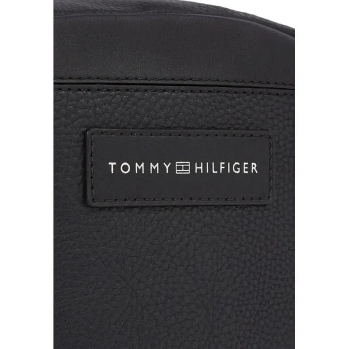 Black leather Tommy Hilfiger Men Bag featuring logo patch for stylish functionality