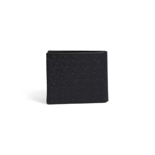 Calvin Klein Men’s black leather wallet with textured pattern on its surface