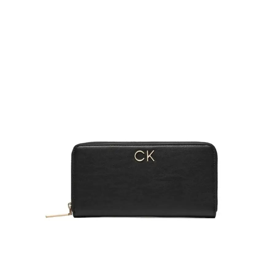 Black leather Calvin Klein women’s wallet with gold ’CK’ logo and zipper closure