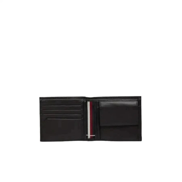 Black leather Tommy Hilfiger men wallet featuring multiple card slots and a coin pocket