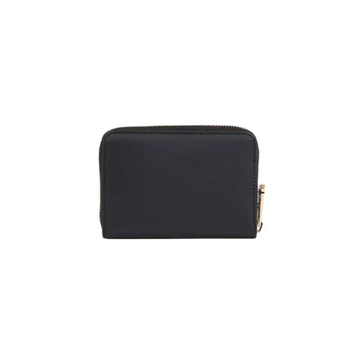 Black leather zip-around wallet with gold-toned hardware by Tommy Hilfiger for women