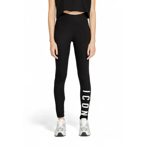 Black leggings with ICON print, styled with a cropped top and silver sneakers